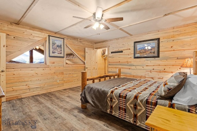 569/571 Cinnabar Basin Rd, Gardiner, MT 59030 - bedroom featuring wood walls, wood finished floors, and ceiling fan