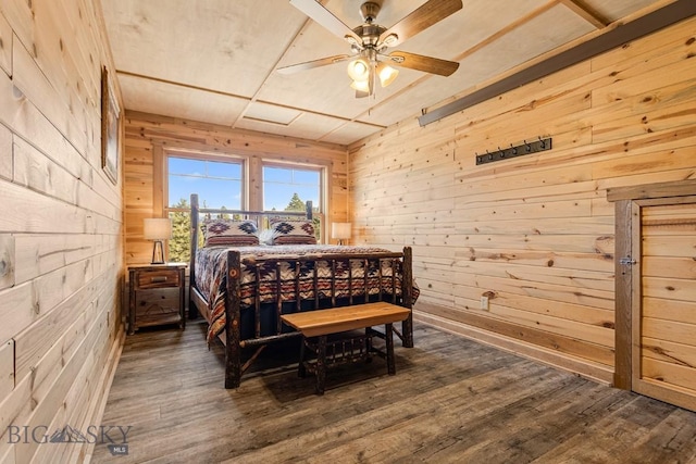 569/571 Cinnabar Basin Rd, Gardiner, MT 59030 - bedroom featuring wooden walls, dark wood-type flooring, and ceiling fan