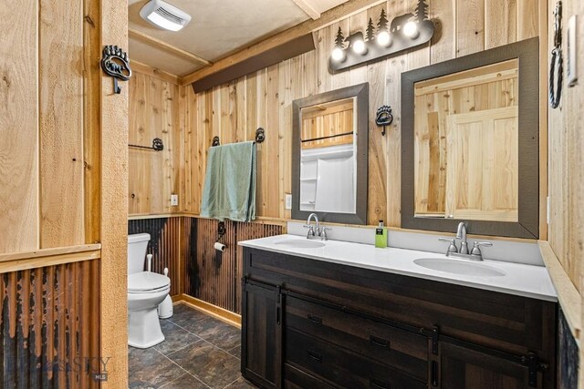 569/571 Cinnabar Basin Rd, Gardiner, MT 59030 - full bath with toilet, wood walls, and double vanity