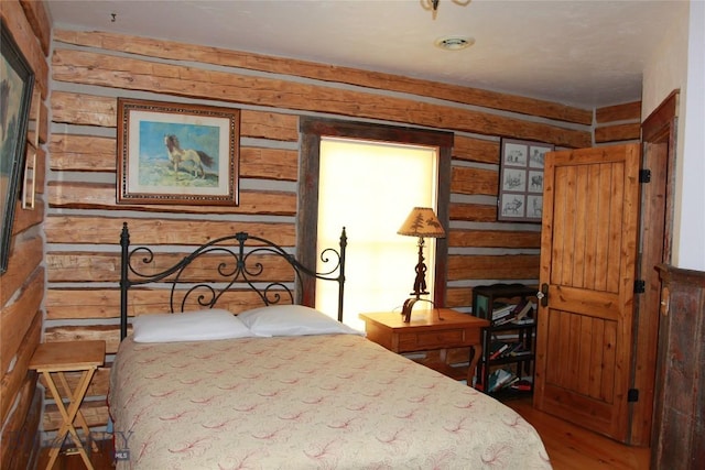 569/571 Cinnabar Basin Rd, Gardiner, MT 59030 - bedroom with wood finished floors and wood walls