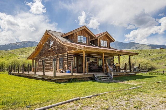 569/571 Cinnabar Basin Rd, Gardiner, MT 59030 - rear view of property featuring a yard and a deck with mountain view