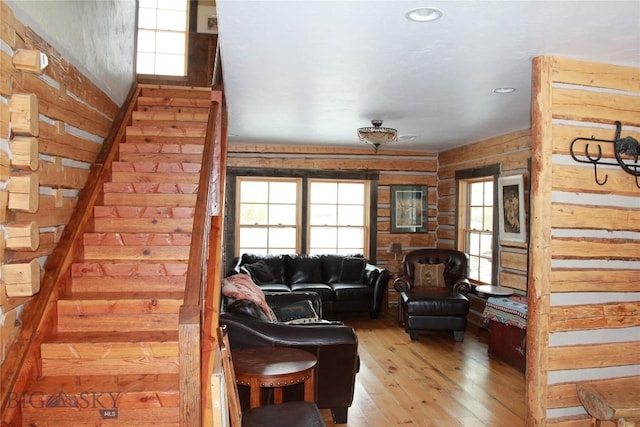 569/571 Cinnabar Basin Rd, Gardiner, MT 59030 - living room with healthy amount of natural light, light wood-type flooring, stairway, wooden walls, and recessed lighting