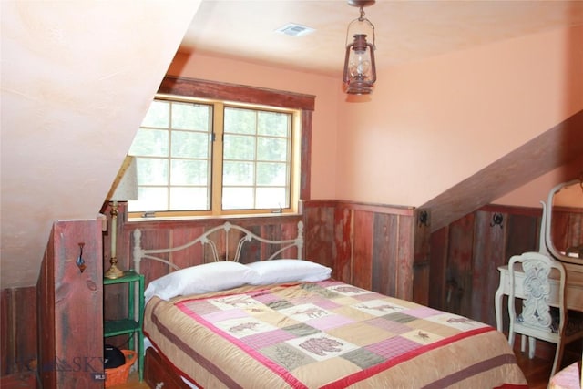 569/571 Cinnabar Basin Rd, Gardiner, MT 59030 - bedroom featuring a wainscoted wall and wood walls