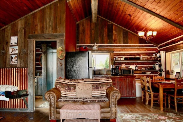 569/571 Cinnabar Basin Rd, Gardiner, MT 59030 - kitchen featuring lofted ceiling, stainless steel appliances, hardwood / wood-style flooring, wooden walls, and wooden ceiling