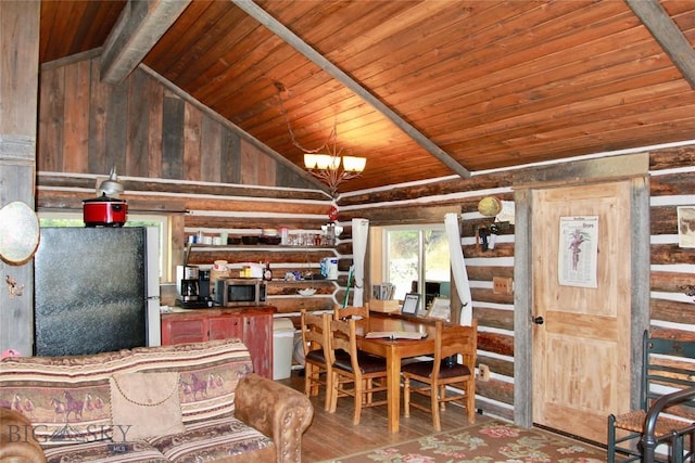 569/571 Cinnabar Basin Rd, Gardiner, MT 59030 - dining area with wooden ceiling, wooden walls, and wood finished floors