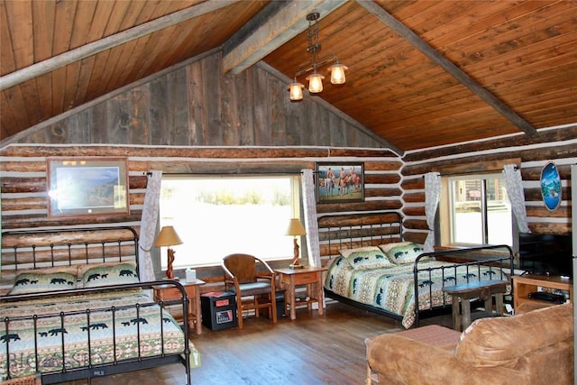 569/571 Cinnabar Basin Rd, Gardiner, MT 59030 - bedroom with log walls, wooden ceiling, hardwood / wood-style floors, high vaulted ceiling, and beamed ceiling