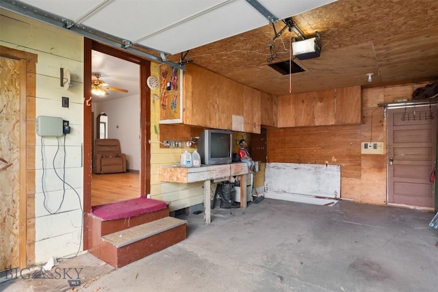1814 Hamburg Ave, Anaconda, MT 59871 - garage featuring a garage door opener and wood walls