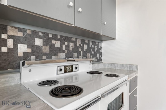 1814 Hamburg Ave, Anaconda, MT 59871 - kitchen with white electric range oven, backsplash, and light countertops