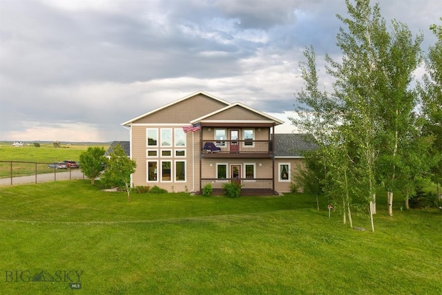46 Rapelje Rd, Big Timber, MT 59011 - back of house with a yard, fence, and a balcony
