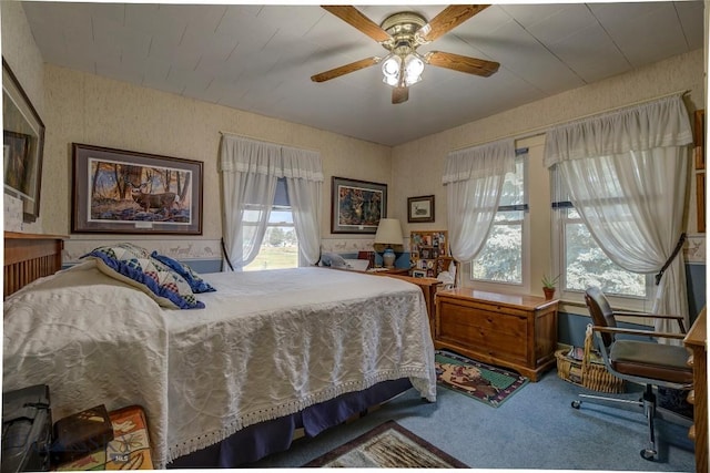 bedroom with a ceiling fan and carpet floors