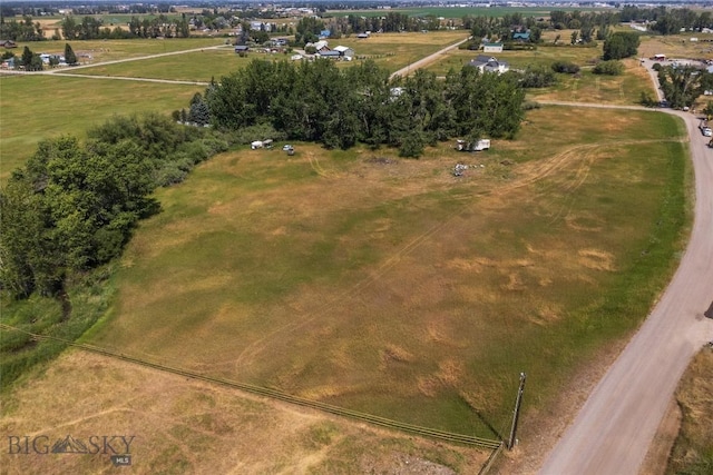birds eye view of property featuring a rural view
