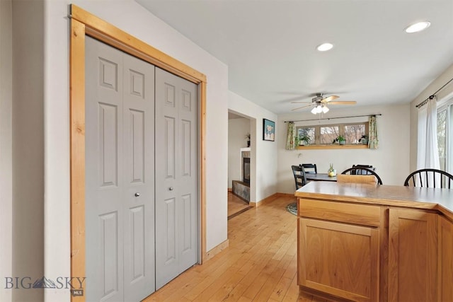 kitchen with light wood-style flooring, a wealth of natural light, recessed lighting, and ceiling fan