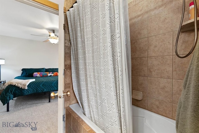 ensuite bathroom featuring tiled shower / bath, ensuite bathroom, and ceiling fan