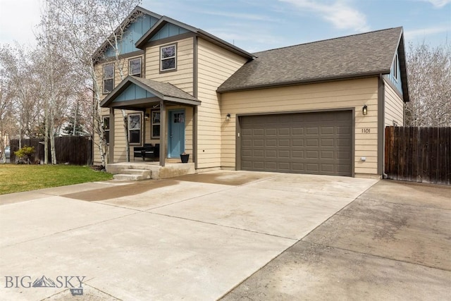 view of front facade with roof with shingles, an attached garage, fence, and concrete driveway