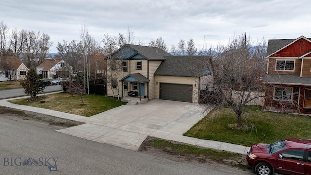 traditional-style home with concrete driveway, a front yard, a garage, and roof with shingles