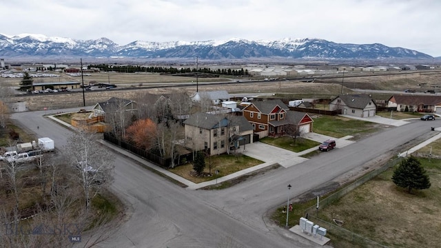 birds eye view of property with a residential view and a mountain view