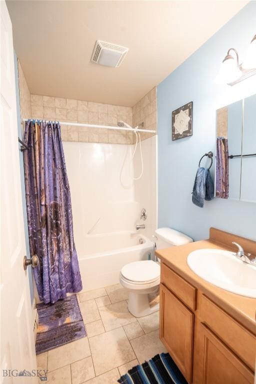 1112 Biehl Unit A, Belgrade, MT 59714 - bathroom with visible vents, toilet, shower / bath combo with shower curtain, vanity, and tile patterned flooring
