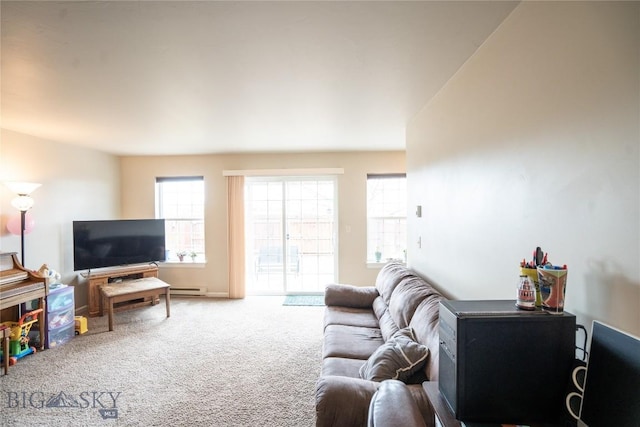 1112 Biehl Unit A, Belgrade, MT 59714 - carpeted living area featuring a baseboard heating unit