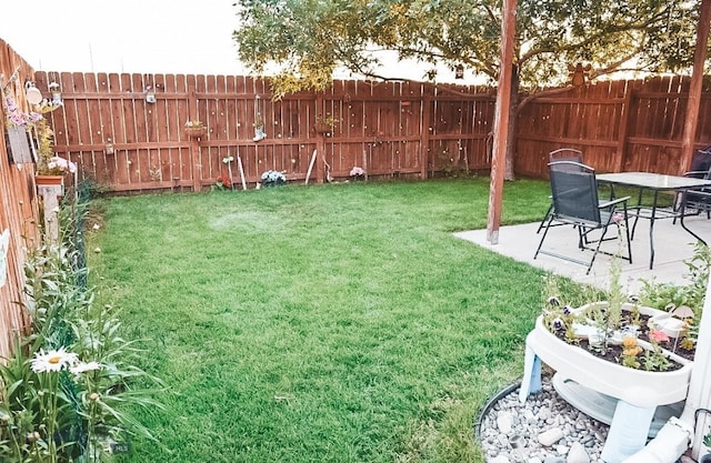 1112 Biehl Unit A, Belgrade, MT 59714 - view of yard featuring a patio area and a fenced backyard