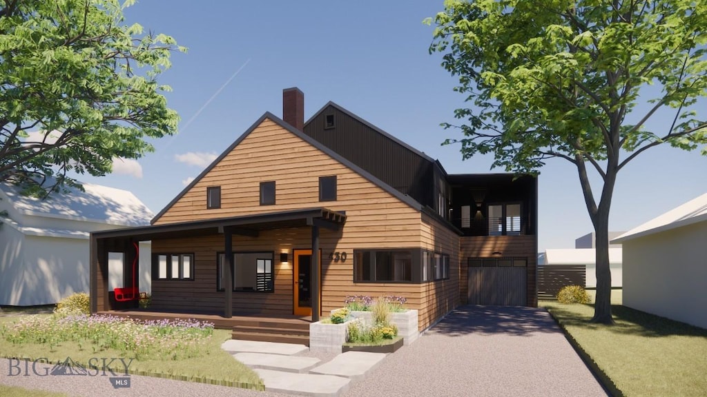 view of front facade with driveway and a chimney