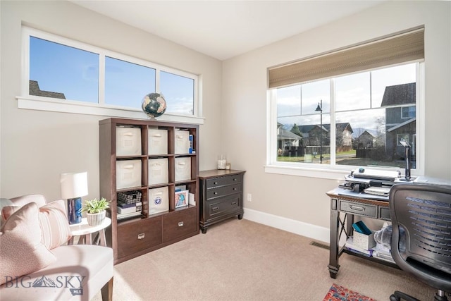 carpeted office with baseboards
