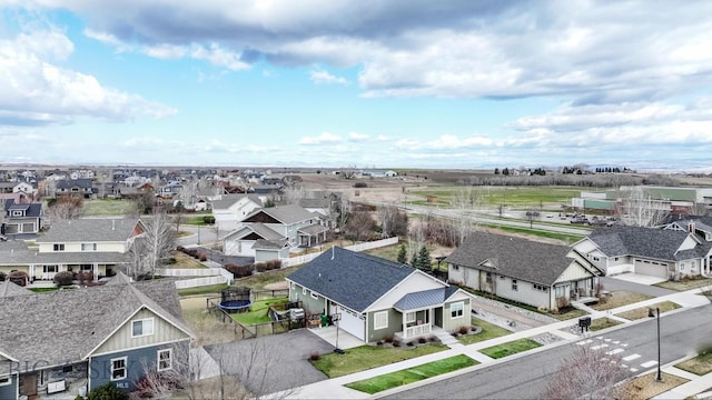 birds eye view of property with a residential view