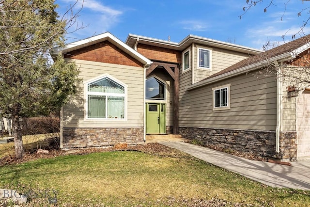 2514 Putter Ct, Bozeman, MT 59715 - view of front facade with stone siding and a front lawn