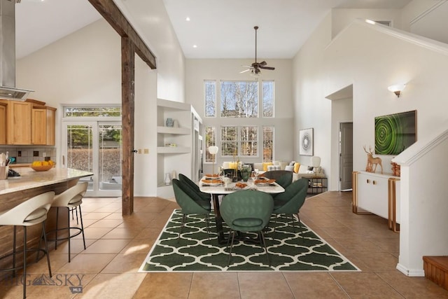 2514 Putter Ct, Bozeman, MT 59715 - dining area with light tile patterned flooring, high vaulted ceiling, a ceiling fan, and a wealth of natural light
