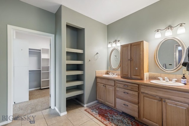 2514 Putter Ct, Bozeman, MT 59715 - full bath with a spacious closet, tile patterned floors, double vanity, and a sink