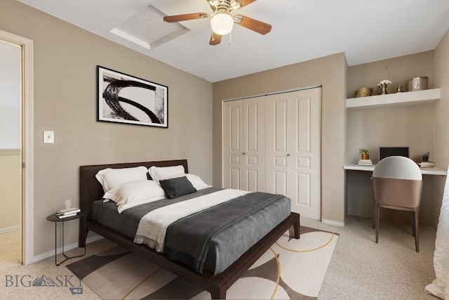 2514 Putter Ct, Bozeman, MT 59715 - bedroom featuring a closet, baseboards, a ceiling fan, and light colored carpet