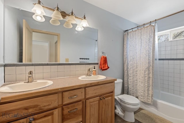 2514 Putter Ct, Bozeman, MT 59715 - full bathroom with toilet, tasteful backsplash, and a sink