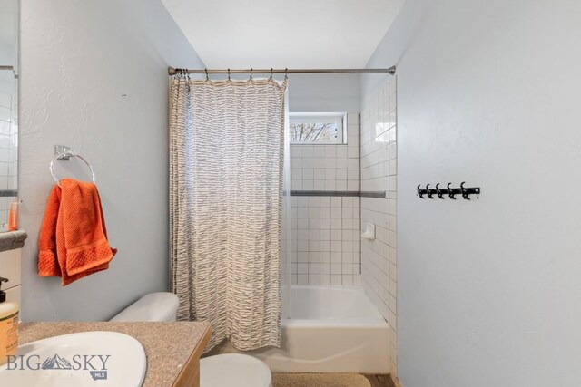 2514 Putter Ct, Bozeman, MT 59715 - bathroom featuring toilet, vanity, and shower / bath combination with curtain