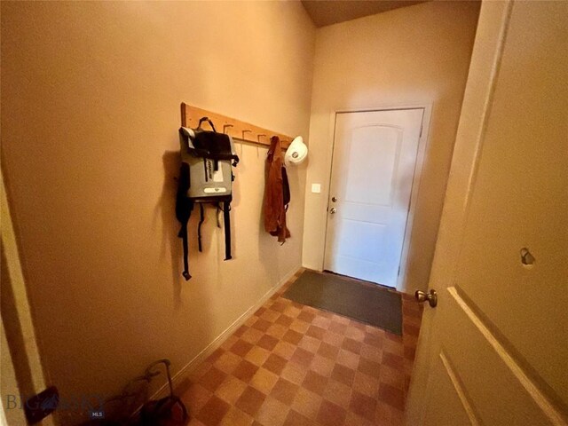 521 E Bannack St, Dillon, MT 59725 - doorway with tile patterned floors and baseboards