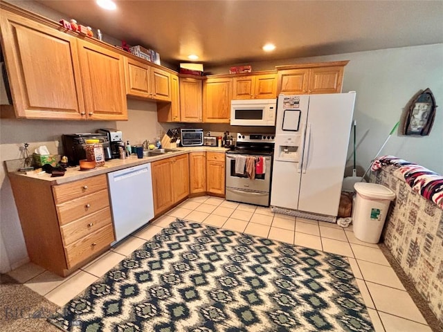 322-328 Vine St, Dillon, MT 59725 - kitchen featuring recessed lighting, white appliances, a sink, and light tile patterned floors
