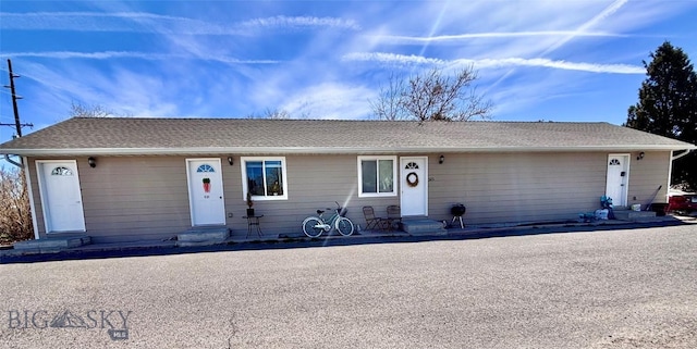 322-328 Vine St, Dillon, MT 59725 - ranch-style house with entry steps and roof with shingles