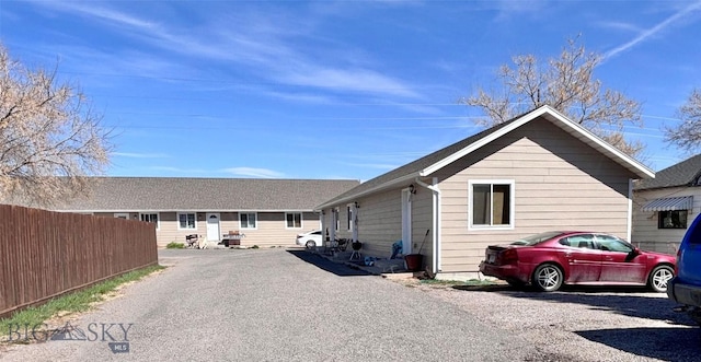322-328 Vine St, Dillon, MT 59725 - view of home's exterior featuring fence