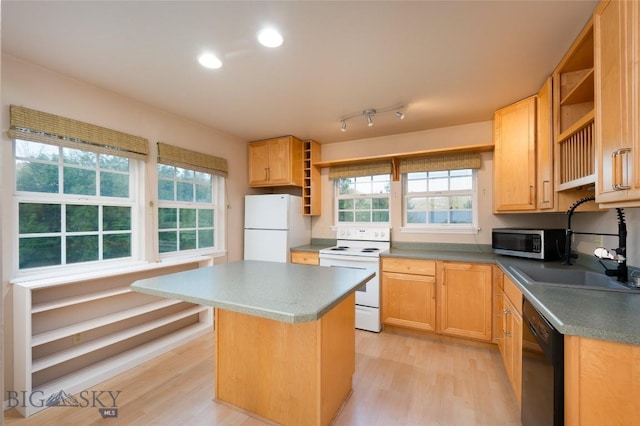 kitchen featuring light wood-type flooring, a center island, open shelves, and white appliances
