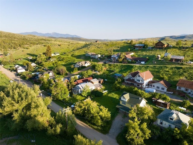 drone / aerial view featuring a residential view and a mountain view