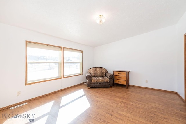 1319 Mcclellan, West Yellowstone, MT 59758 - sitting room with light wood-style flooring and baseboards