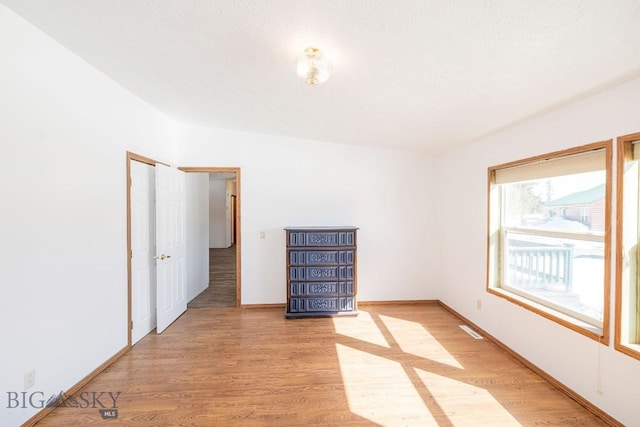 1319 Mcclellan, West Yellowstone, MT 59758 - spare room with light wood-type flooring and baseboards