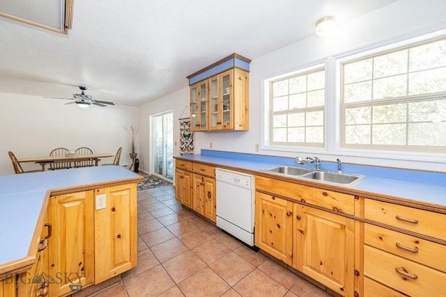 1319 Mcclellan, West Yellowstone, MT 59758 - kitchen featuring white dishwasher, light tile patterned floors, a ceiling fan, glass insert cabinets, and light countertops