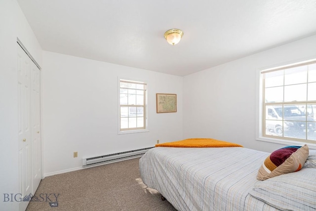 1319 Mcclellan, West Yellowstone, MT 59758 - bedroom with a baseboard heating unit, carpet floors, and a closet