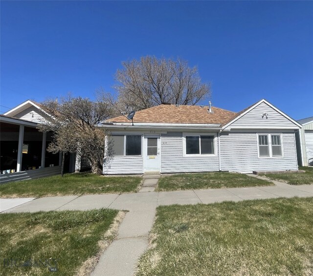 415 E Geyser, Livingston, MT 59047 - view of front of house featuring a front lawn and roof with shingles