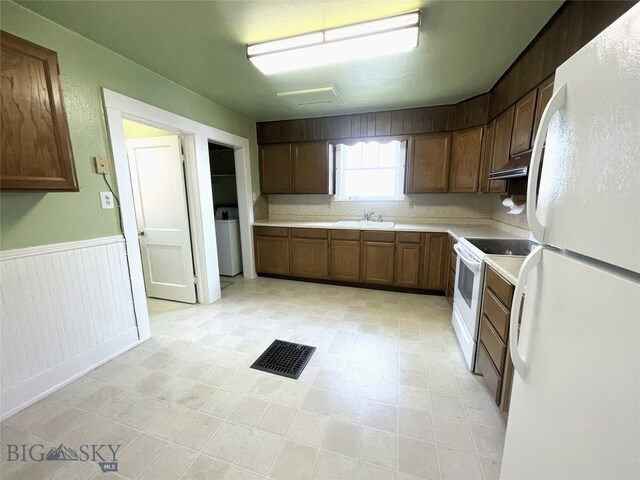 415 E Geyser, Livingston, MT 59047 - kitchen with white appliances, visible vents, under cabinet range hood, light countertops, and a sink