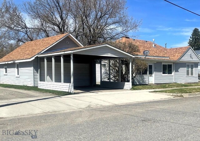 415 E Geyser, Livingston, MT 59047 - view of front of house with a garage and roof with shingles