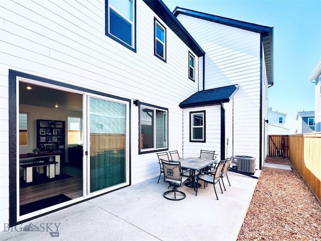 1823 N Cottonwood Rd, Bozeman, MT 59718 - view of patio with a fenced backyard, central AC, and outdoor dining space