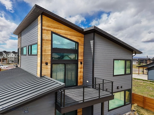 exterior space with fence and a balcony