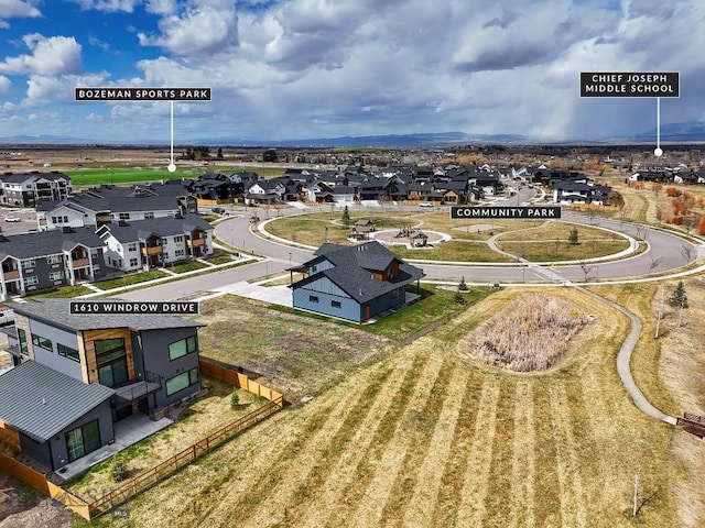 birds eye view of property with a residential view