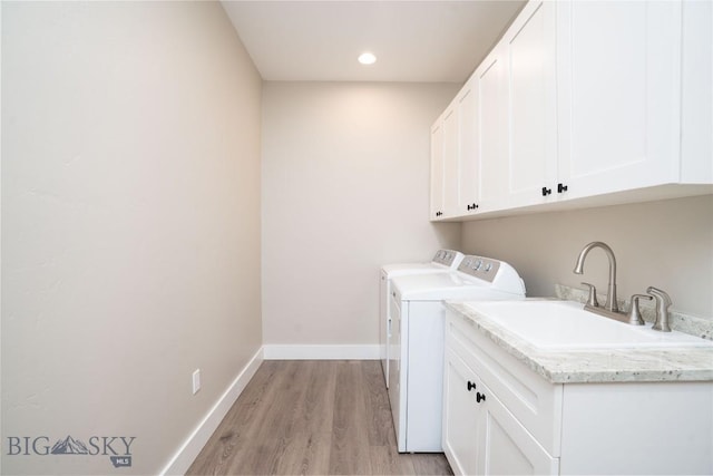 1610 Windrow Dr, Bozeman, MT 59718 - laundry room with washer and dryer, cabinet space, light wood-style flooring, baseboards, and recessed lighting