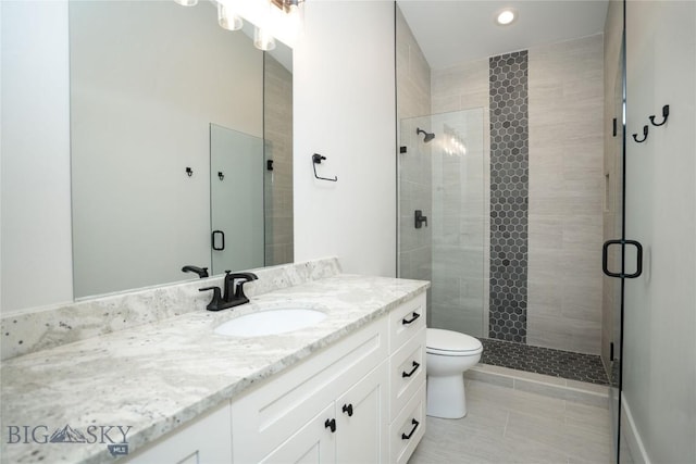 1610 Windrow Dr, Bozeman, MT 59718 - full bathroom featuring vanity, a shower stall, toilet, tile patterned floors, and recessed lighting